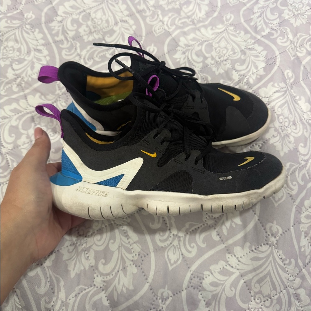 Nike Black and White Sneakers with Blue and Yellow Accents